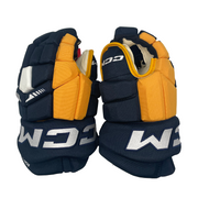 CCM HGTKXP - Gant NCAA Pro Stock (bleu marine/jaune)