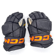 Gants de hockey CCM HGJSPP Pro Stock d'occasion (noir/or/marron) n° 1