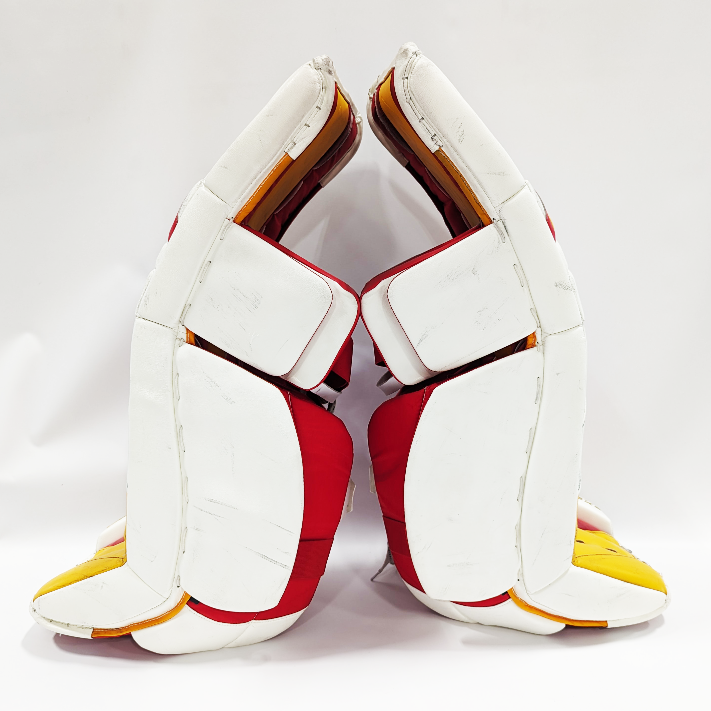 CCM Extreme Flex 5 - Jambières de gardien de but AHL Pro Stock d'occasion (blanc/rouge/jaune)
