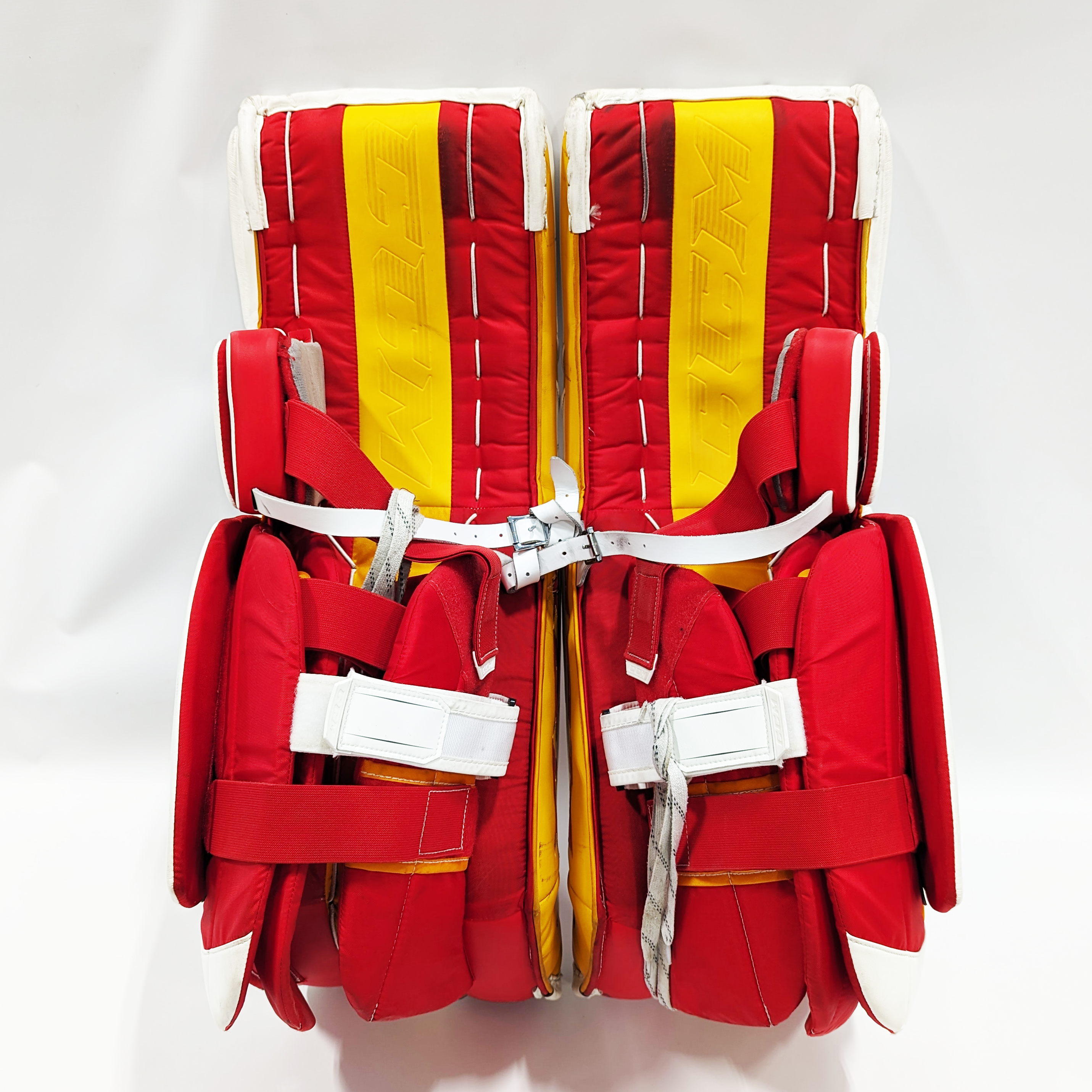 CCM Extreme Flex 5 - Jambières de gardien de but AHL Pro Stock d'occasion (blanc/rouge/jaune)